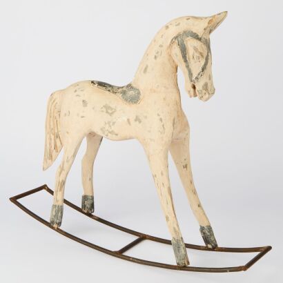 A Wooden Rocking Horse on metal Base