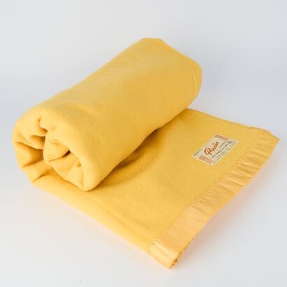 A Citrus Onehunga Princess Blanket with Tiki Label