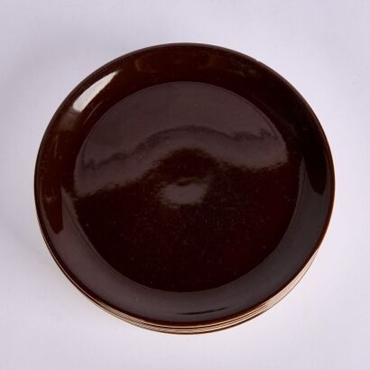 A Set of Six Crown Lynn Colour Ware Side Plates in Dark Brown