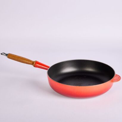 A Le Creuset Wooden handled Cast Iron Frying Pan 28cm Red
