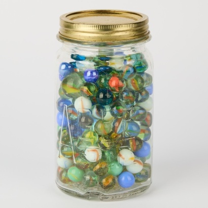 A Vintage Agee Jar filled with Marbles