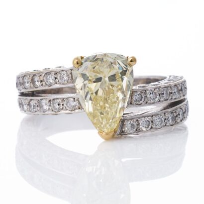 18ct White Gold, Modern, 3.02ct Fancy Yellow Pear Shaped / 1.54ct Diamond Ring, circa 1995