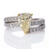 18ct White Gold, Modern, 3.02ct Fancy Yellow Pear Shaped / 1.54ct Diamond Ring, circa 1995