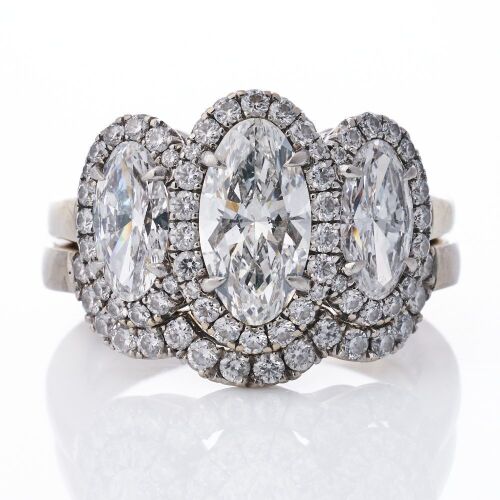 An Important, 18ct White Gold, 1.12ct Moval Cut / 1.05ct Moval / 0.36ct Diamond Ring - GIA certified / 0.24ct Diamond Band