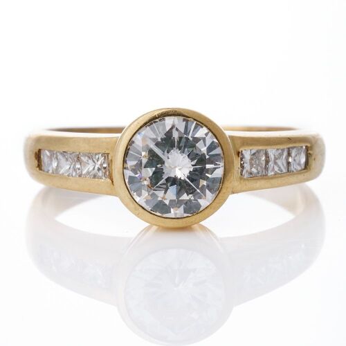 18ct Yellow Gold, 1.09ct Round Brilliant Cut Diamond / 0.37ct Princess Cut Diamond, Accented Solitaire Ring