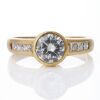 18ct Yellow Gold, 1.09ct Round Brilliant Cut Diamond / 0.37ct Princess Cut Diamond, Accented Solitaire Ring