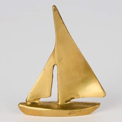 A Brass Paperweight Ship