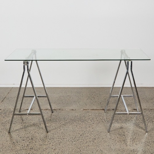 A Modern Glass and Chrome Trestle Table