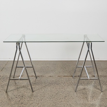 A Modern Glass and Chrome Trestle Table