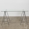A Modern Glass and Chrome Trestle Table