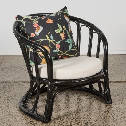 A Black Cane Lounge Chair with Boucle Cushion