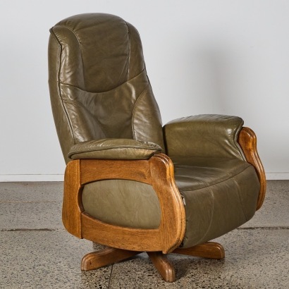 A Vintage Scandinavian Oak-Framed Leather Swivel Recliner