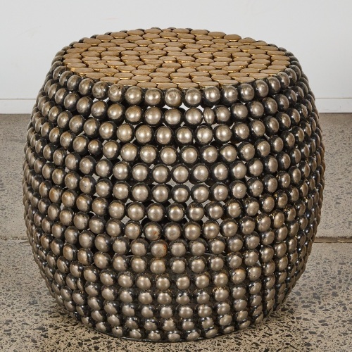 A Large Round Metal Bobbin Table