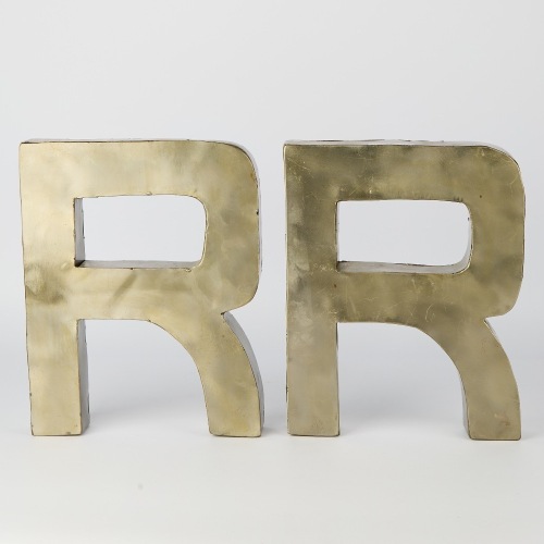 A Pair of Metal Letter "R" Wall Signs