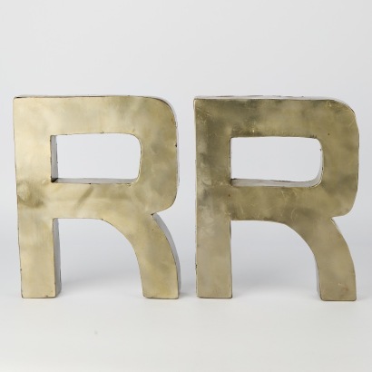 A Pair of Metal Letter "R" Wall Signs