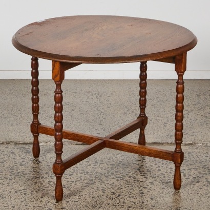 A Vintage Circular Oak Coffee Table with Turned Legs