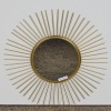 A Gold Starburst Wall Mirror
