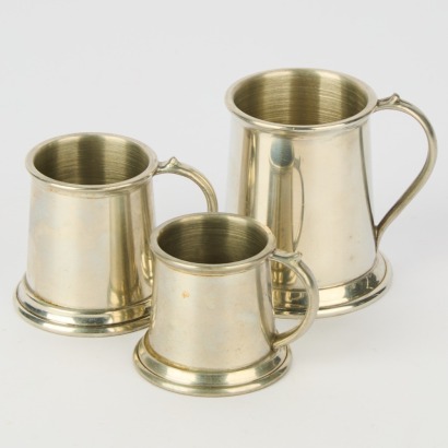 A Set of Three English Pewter Tankard