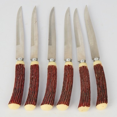 A Set of Faux Stag Horn Retro Steak Knives