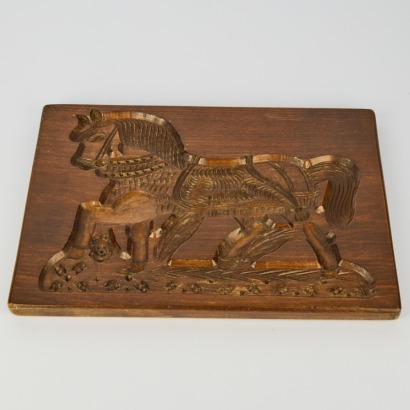 An Antique Wood Carved Horse Cake Board