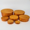 A stack of seven Bentwood Shaker Maple Boxes with swallow-tail joint construction
