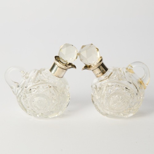 A Pair of Cut Glass Oil Decanters by John Grinsell and Sons