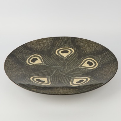 A Very Large Black Peacock Platter
