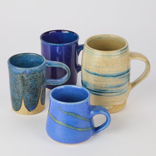 A Collection of Blue Studio Pottery Mugs