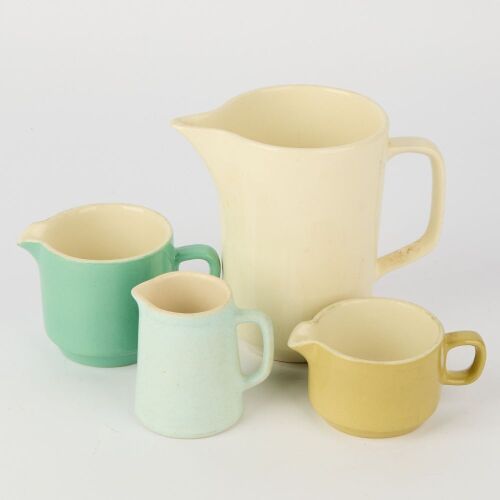 A Set of Four Crown Lynn Jugs