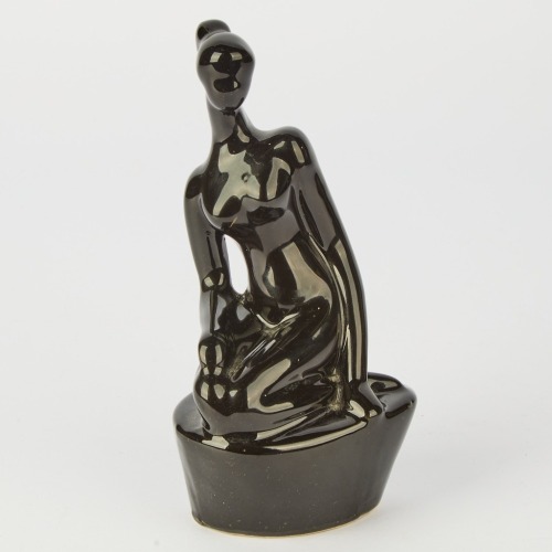 A Mid-Century Woman's Pottery Figurine