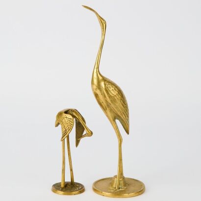 A Pairing of Brass Herons