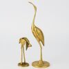 A Pairing of Brass Herons