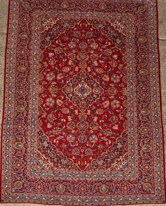A Large Hand-Knotted Wool Kashan Rug