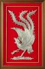 A Framed Phoenix Decoration in silver