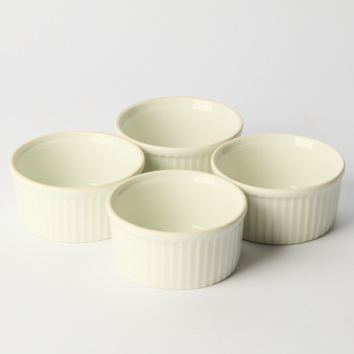 A Set of Four Apilco France Porcelain Pleated Ramekins