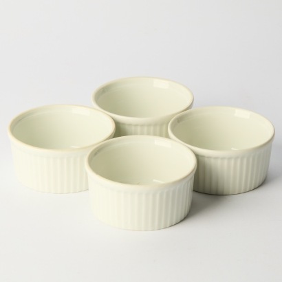 A Set of Four Apilco France Porcelain Pleated Ramekins