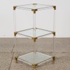 A Lucite and Brass Display Table