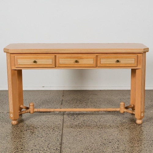 A Neoclassical Limed-Oak Three-Drawer Console Table
