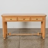A Neoclassical Limed-Oak Three-Drawer Console Table