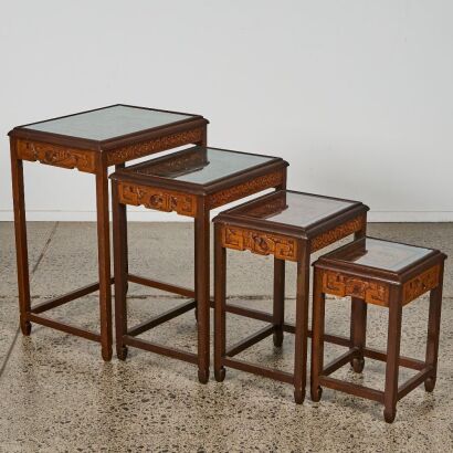 A Chinese Early 20th Century NestedTables Carved with Figure Decoration