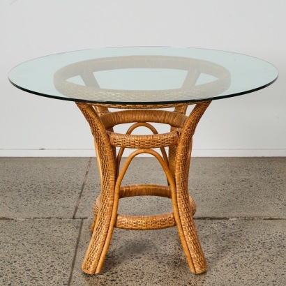 A Vintage Rattan Dining Table with Glass Top