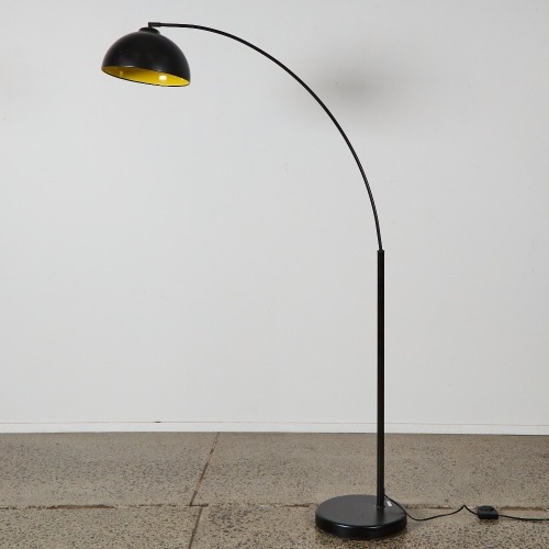 An Arched Floor Lamp with Yellow Inner Shade