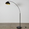 An Arched Floor Lamp with Yellow Inner Shade