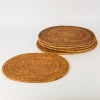 A Set of Six Oval Rattan Woven Placemats