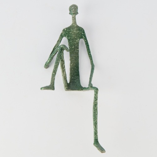 A Contemplative Metal Table Ornament