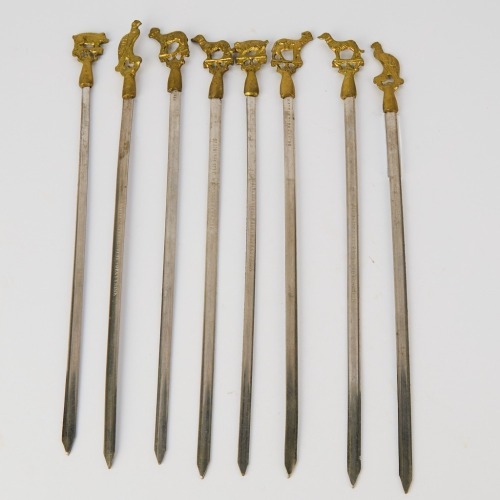 A collection of eight Stainless Steel Kebab Skewers featuring Brass Animals