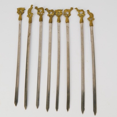 A collection of eight Stainless Steel Kebab Skewers featuring Brass Animals