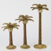 A Trio of Cast Palm Tree Candlesticks
