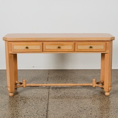 A Neoclassical Limed-Oak Three-Drawer Console Table