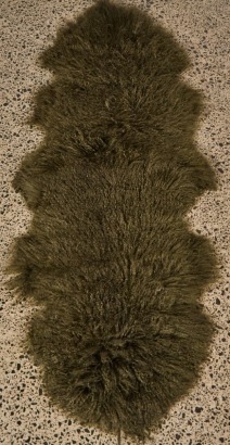 A Tiberan Lamb Rug in Olive